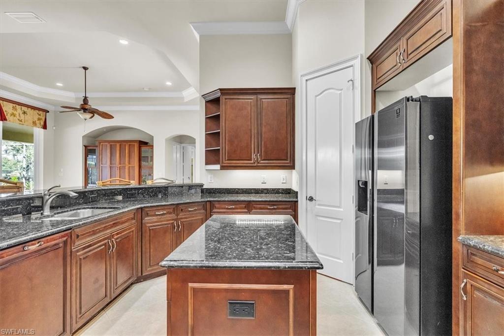 3331 Sanctuary Point Fort Myers, FL 33905 - Photo 17 of 50 a kitchen with stainless steel appliances granite countertop a sink and a refrigerator