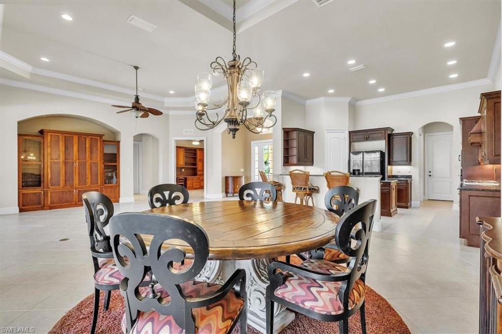 3331 Sanctuary Point Fort Myers, FL 33905 - Photo 20 of 50 a view of a dining room with furniture and chandelier