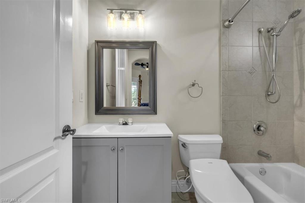 3331 Sanctuary Point Fort Myers, FL 33905 - Photo 35 of 50 a bathroom with a sink a toilet and shower