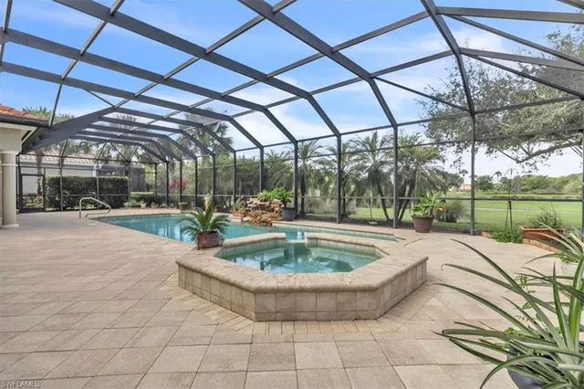 a view of a swimming pool with a patio