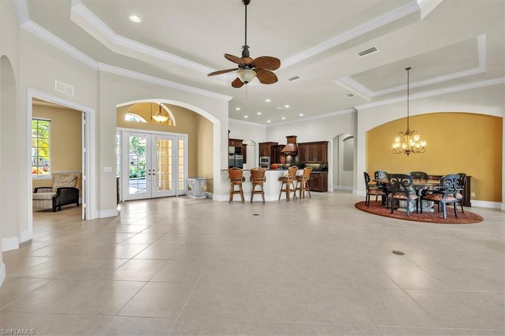 3331 Sanctuary Point Fort Myers, FL 33905 - Photo 8 of 50 a view of a room with dining table a chandelier a living room and chandelier