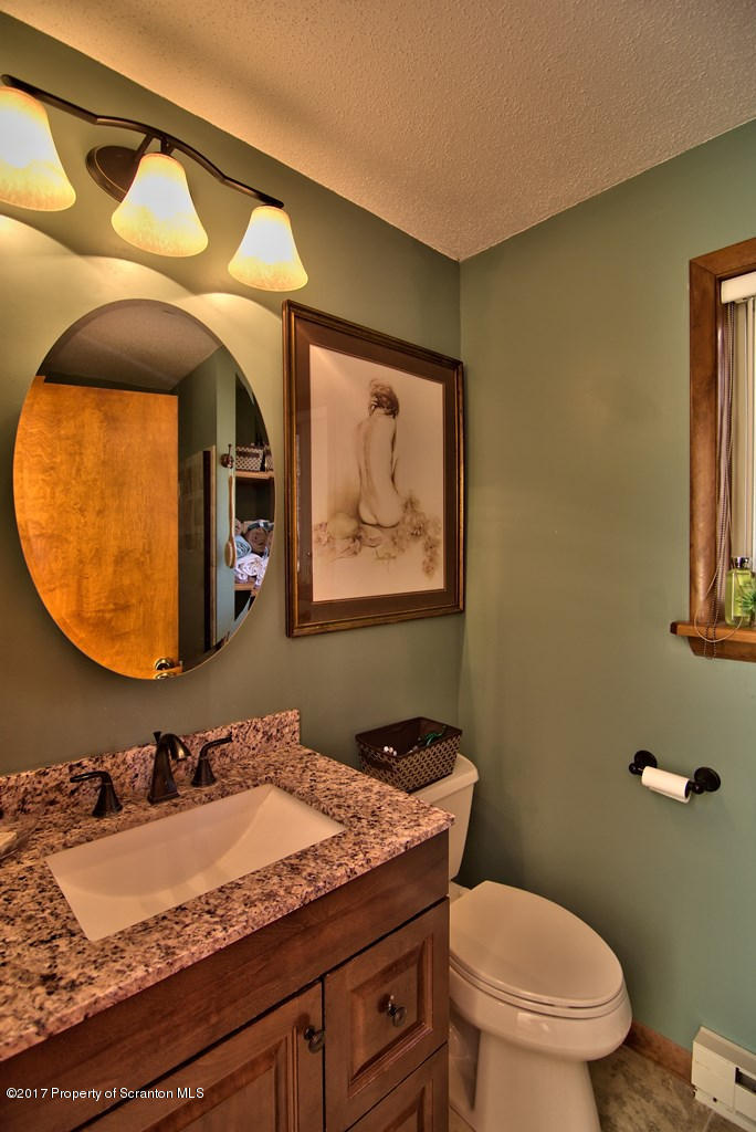 3304 Northgate Road Lake Ariel, PA 18436 - Photo 17 of 26 a bathroom with a granite countertop sink and a mirror