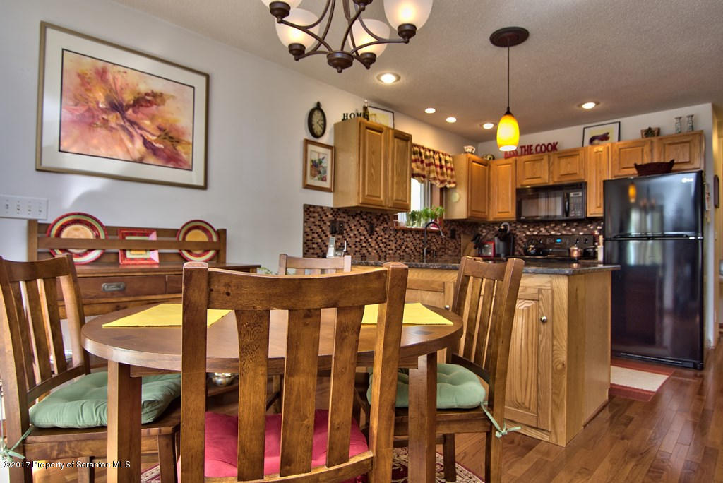 3304 Northgate Road Lake Ariel, PA 18436 - Photo 6 of 26 a view of a dining room with furniture and wooden floor