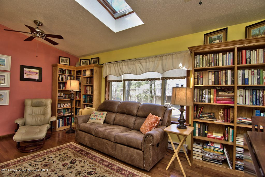 3304 Northgate Road Lake Ariel, PA 18436 - Photo 8 of 26 a living room with furniture and a book shelf