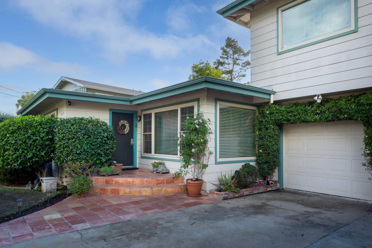 26436 Oliver Road Carmel, CA 93923 - Photo 5 of 25 front view of a house with a patio