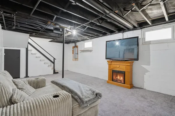 a bedroom with a bed and a television