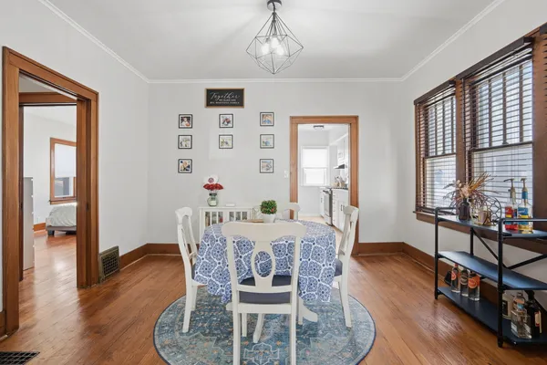 a dining room with furniture window wooden floor