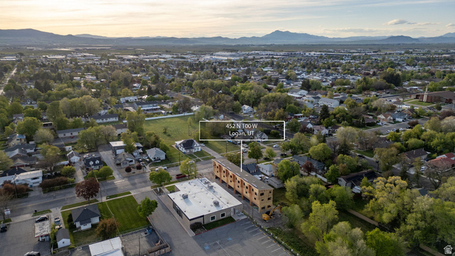 452 North 100 West, Unit 102 Logan, UT 84321 - Photo 22 of 34 Aerial perspective of suburban area with mountains and property boundaries highlighted