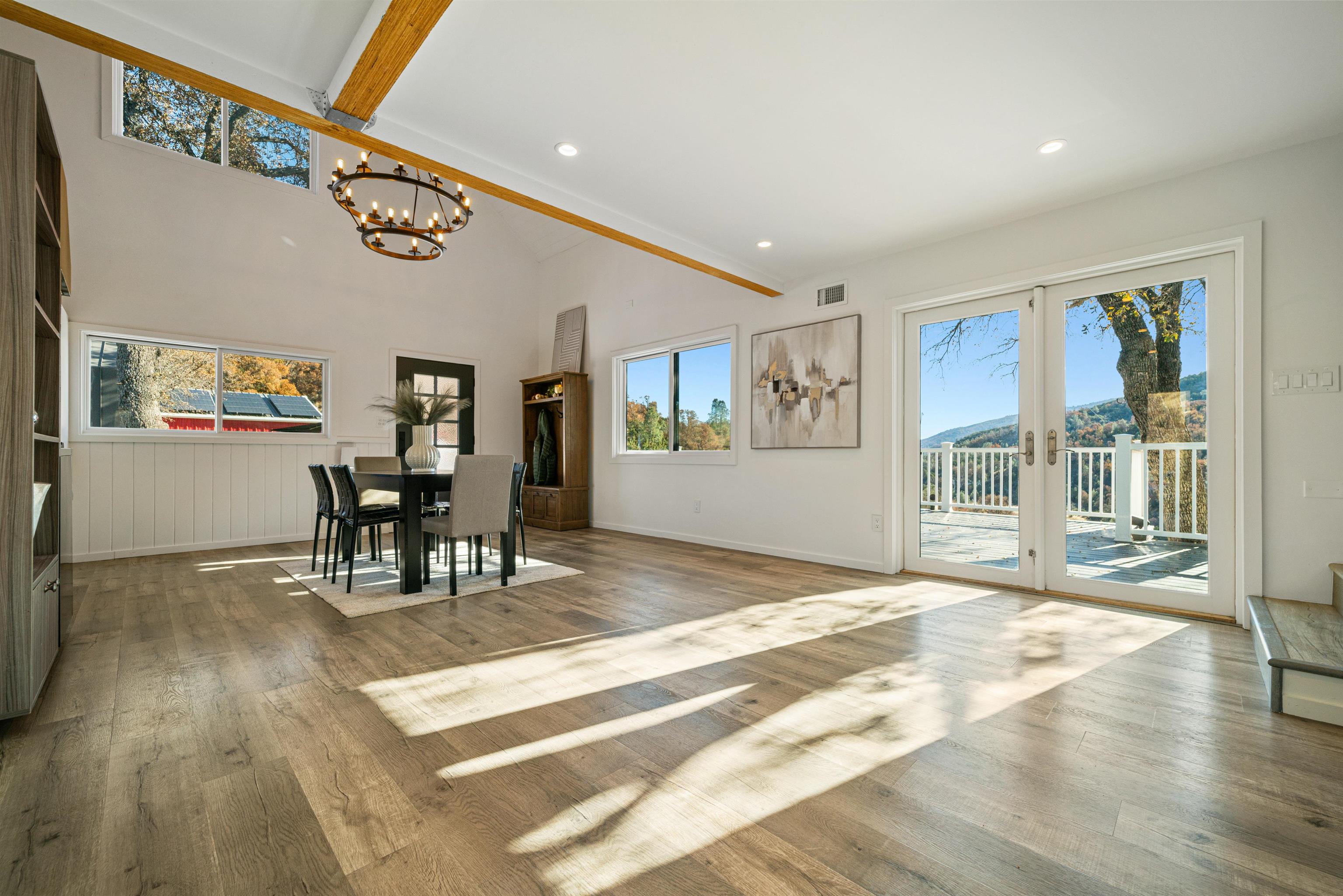 21000 Mines Road Livermore, CA 94550 - Photo 15 of 56 a view of a livingroom with furniture a rug wooden floor and windows