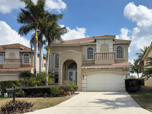 a front view of a house with yard