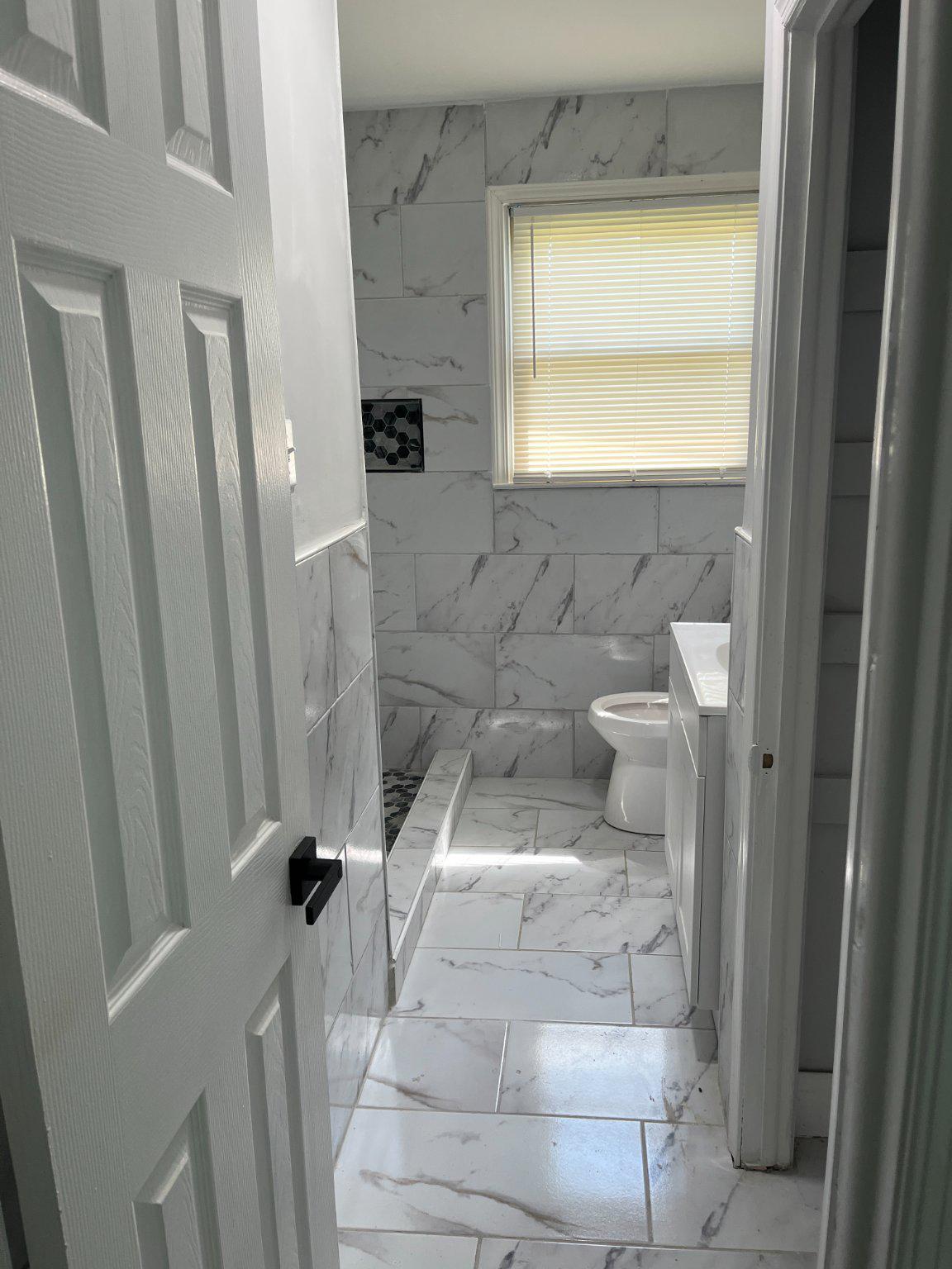 2405 Limestone Road Wilmington, DE 19808 - Photo 22 of 40 a bathroom with a sink toilet and shower