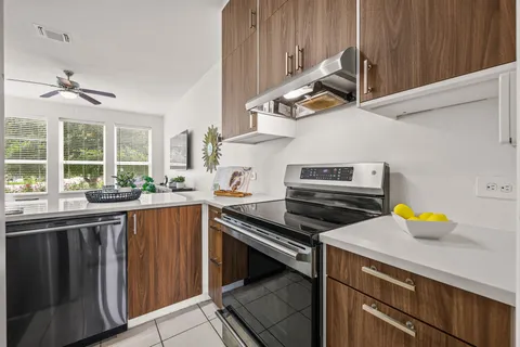 a kitchen with a stove a sink and a stove