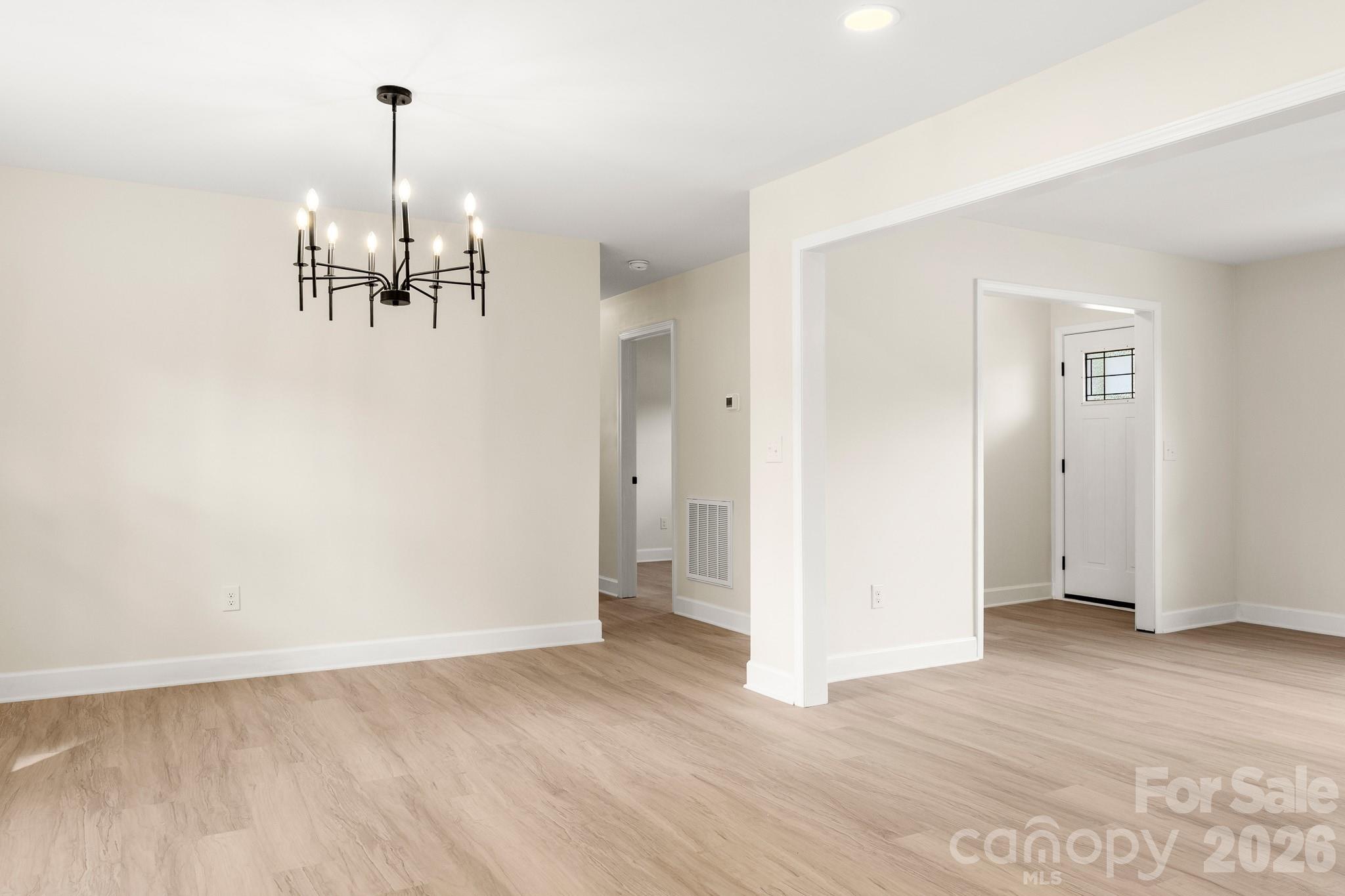 1152 Mt Holly Road Rock Hill, SC 29730 - Photo 22 of 41 a view of a room with wooden floor and a ceiling fan