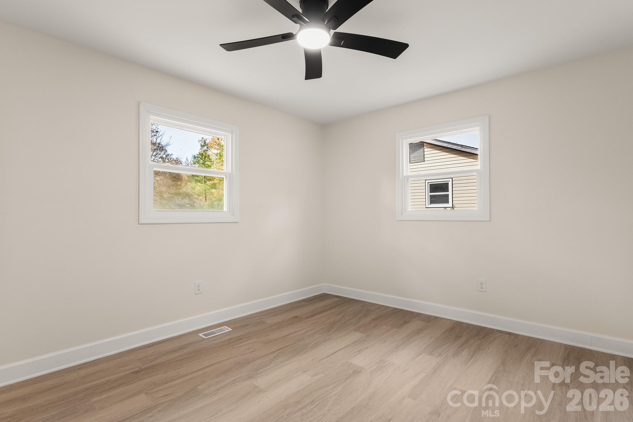 1152 Mt Holly Road Rock Hill, SC 29730 - Photo 30 of 41 wooden floor in an empty room with a window