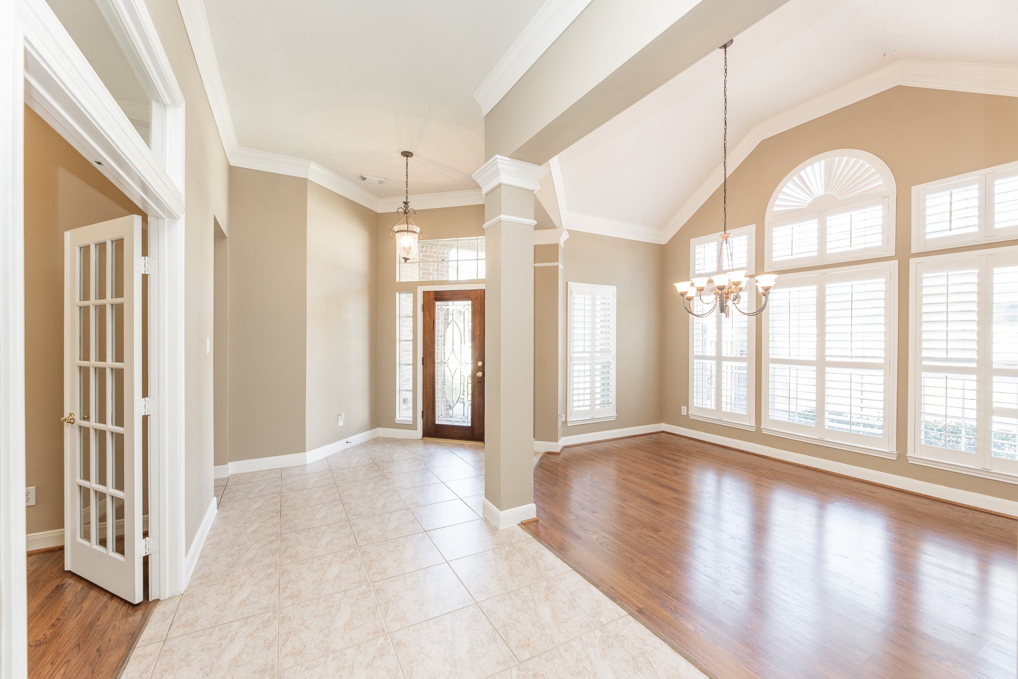 1222 Brinson Court Spring, TX 77379 - Photo 5 of 35 a view of an empty room with wooden floor and a window