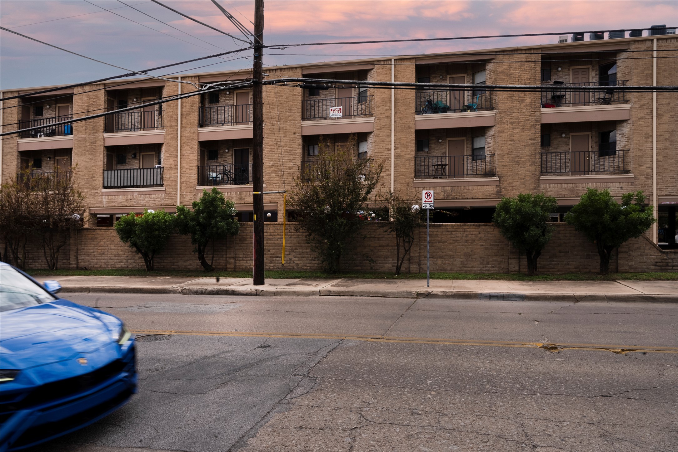 3316 Guadalupe Street, Unit 306 Austin, TX 78705 - Photo 14 of 28 Property at dusk with a view of apartment building / complex