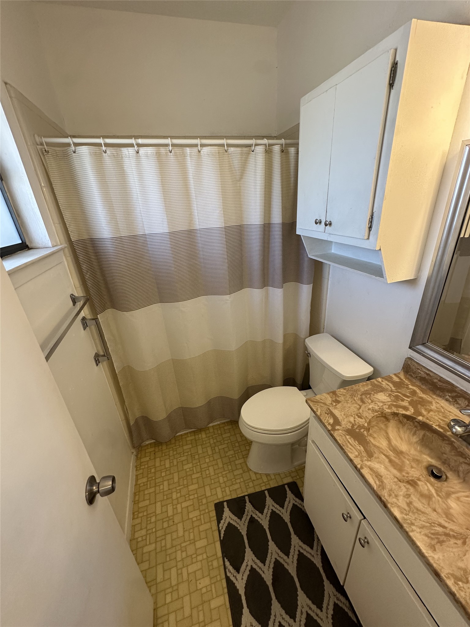 3316 Guadalupe Street, Unit 306 Austin, TX 78705 - Photo 17 of 28 Bathroom featuring vanity and curtained shower