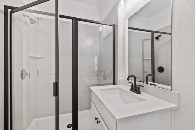 a bathroom with a sink and mirror