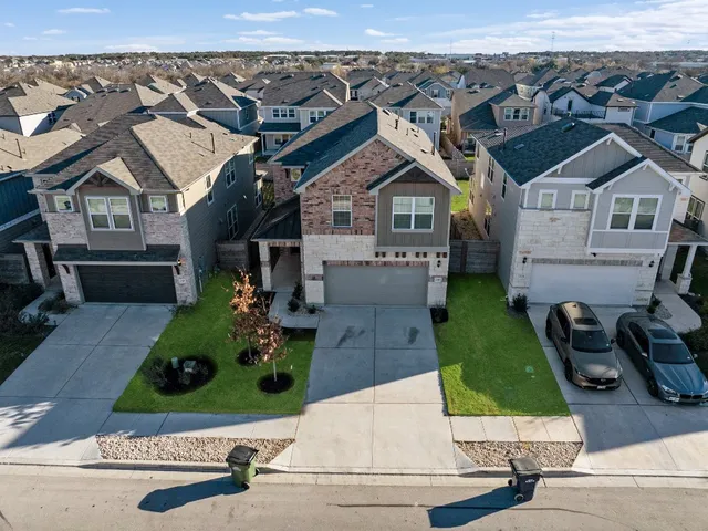 an aerial view of a house with a garden