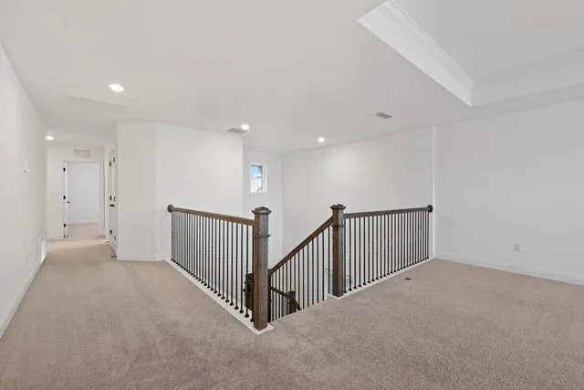 a view of a hallway with staircase