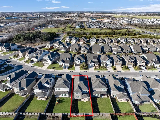 an aerial view of a yard with seating space