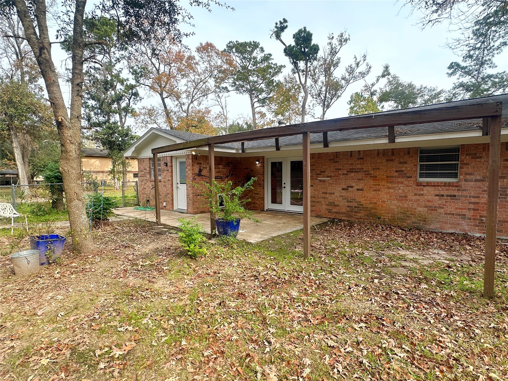 24342 East Webb Road Porter, TX 77365 - Photo 15 of 15 a view of a house with a yard