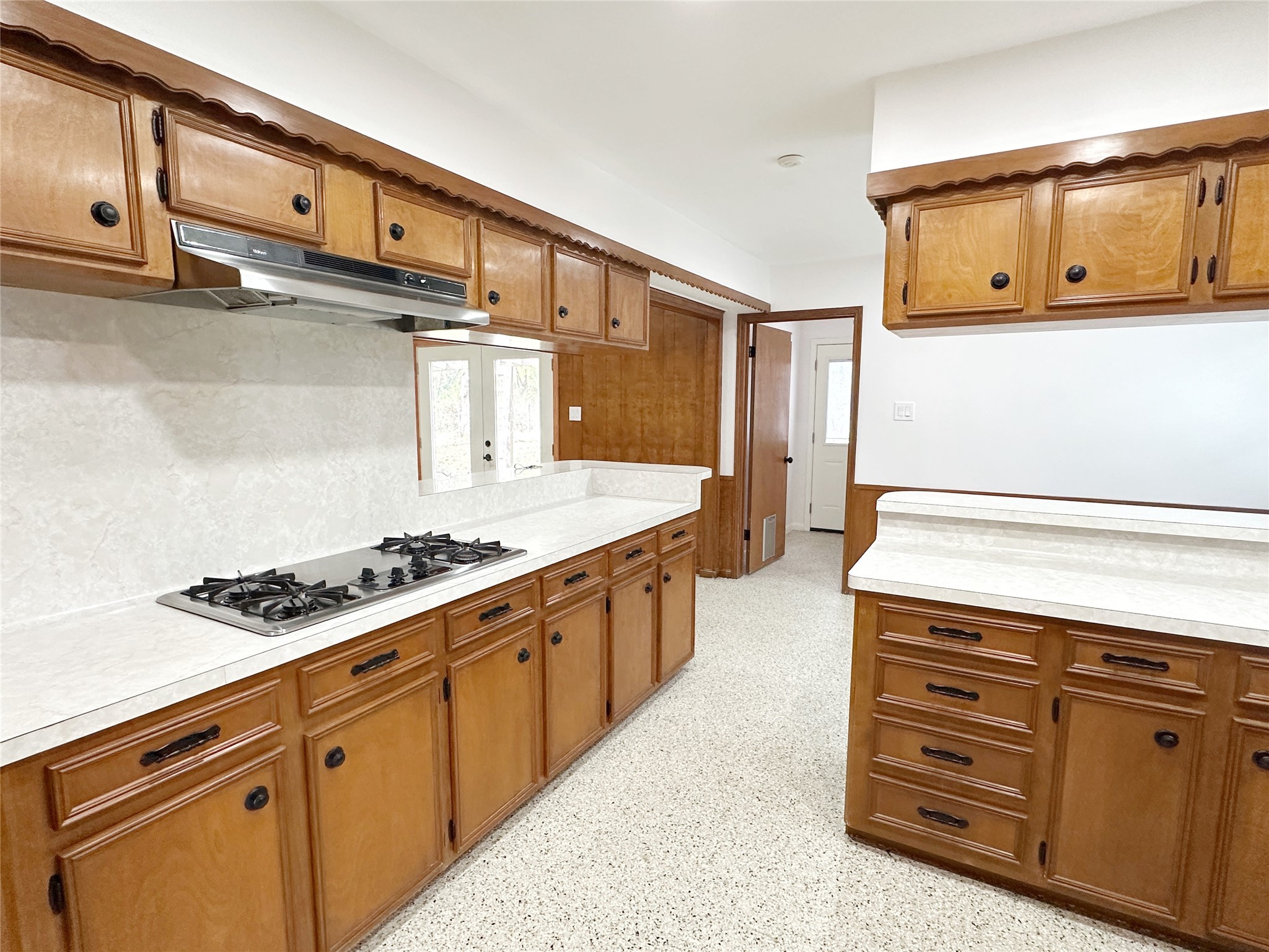 24342 East Webb Road Porter, TX 77365 - Photo 6 of 15 a kitchen with stainless steel appliances granite countertop a stove and a refrigerator