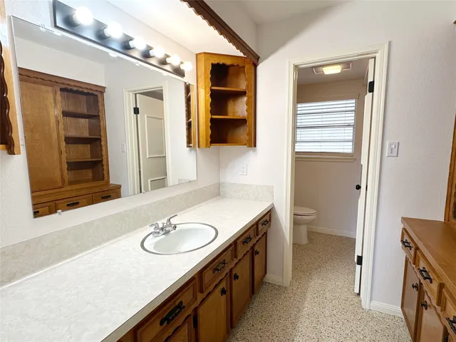 a bathroom with a sink double vanity and a mirror