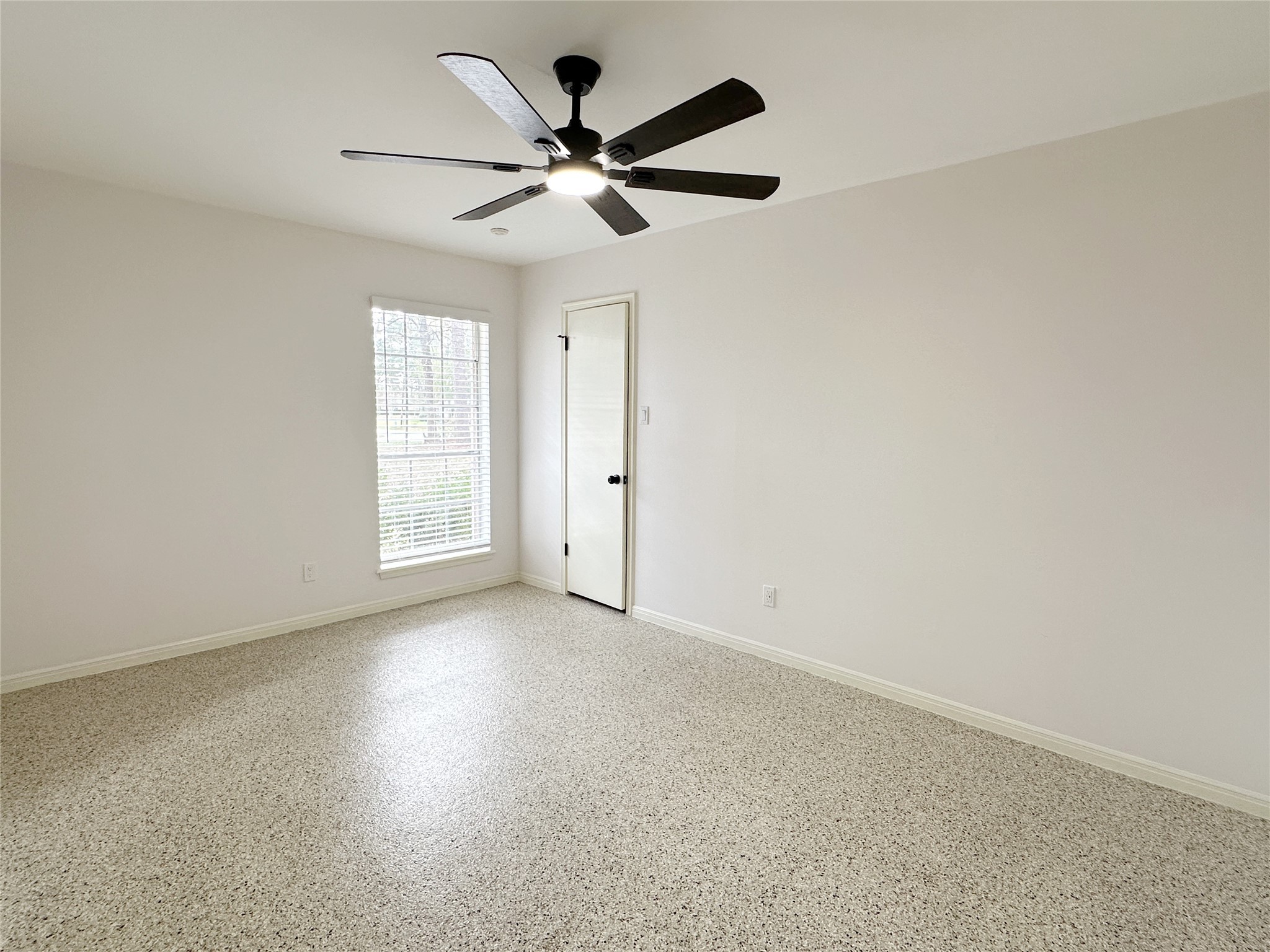 24342 East Webb Road Porter, TX 77365 - Photo 10 of 15 an empty room with windows and fan