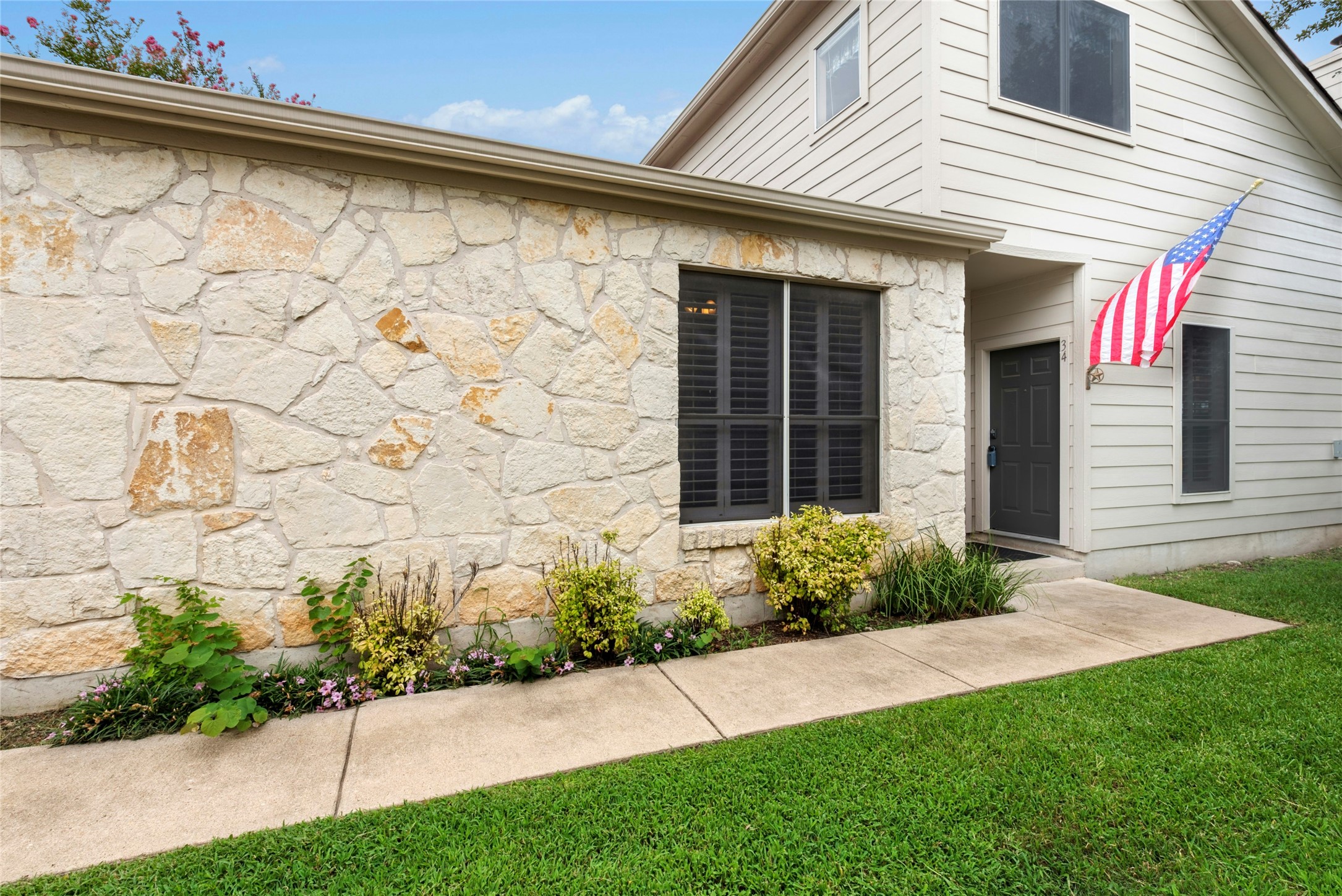 7500 Shadowridge Run, Unit 34 Austin, TX 78749 - Photo 2 of 27 a view of a backyard with plants