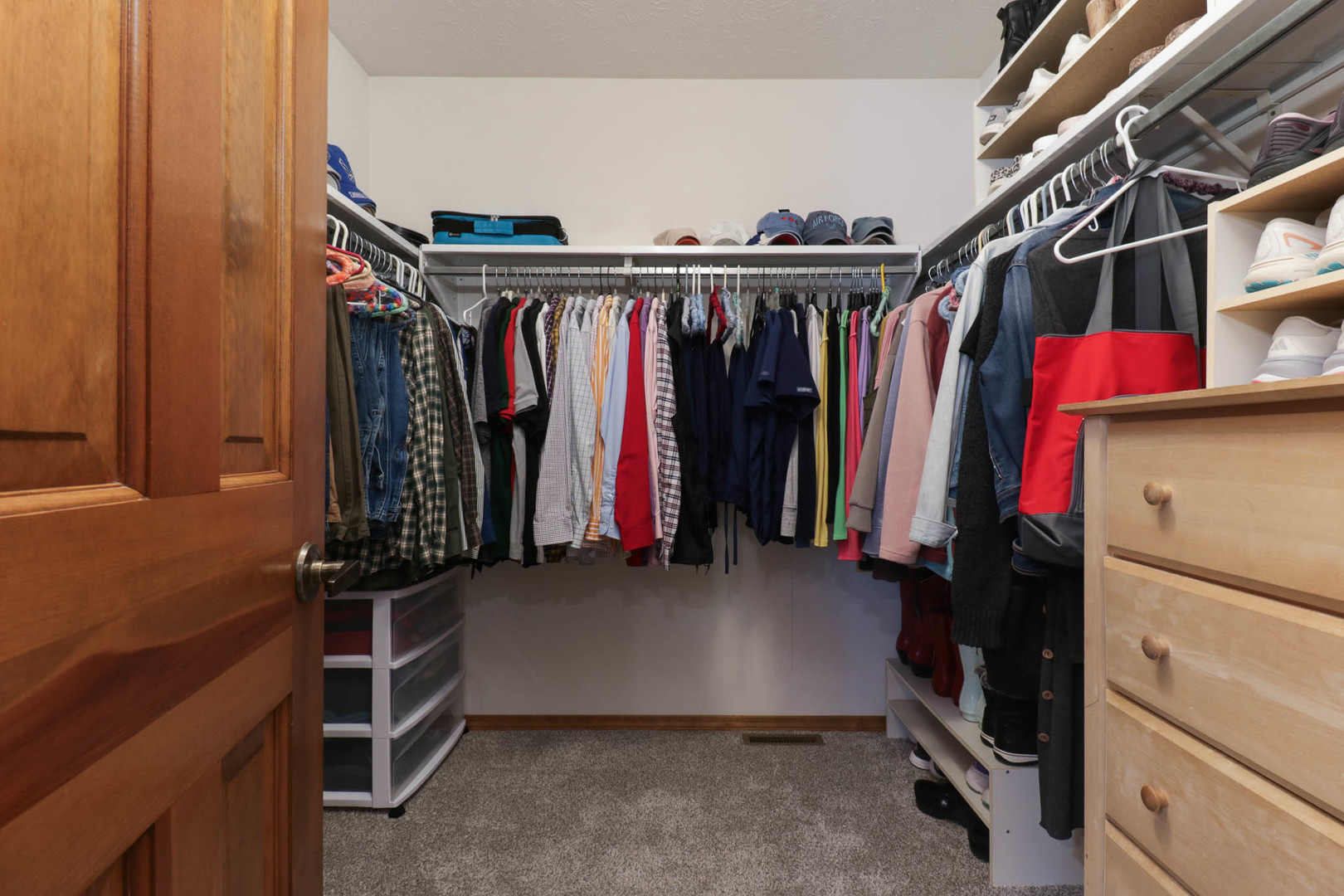 3203 Eagle Crest Road Bloomington, IL 61704 - Photo 24 of 52 a view of walk in closet with clothes