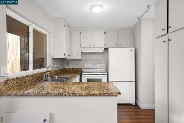 a kitchen that has a sink and a window