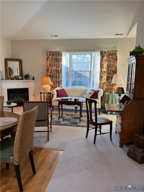 19 Bay Court Kilmarnock, VA 22482 - Photo 15 of 48 a living room with furniture a flat screen tv and a fireplace