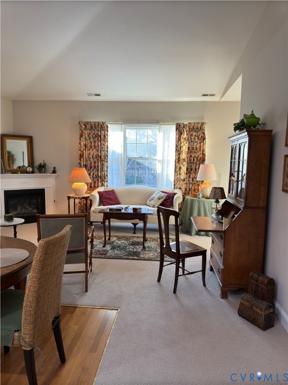 19 Bay Court Kilmarnock, VA 22482 - Photo 23 of 48 a living room with furniture a fireplace and a large window