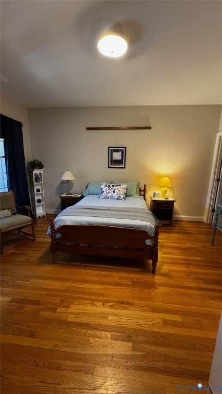 19 Bay Court Kilmarnock, VA 22482 - Photo 35 of 48 a bedroom with a bed and wooden floor