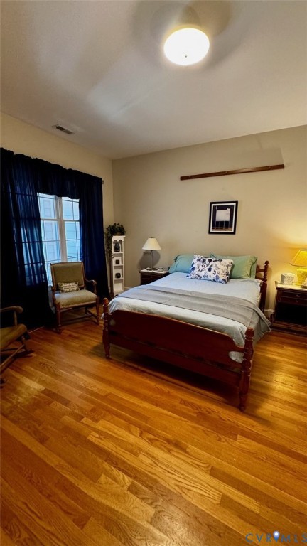 19 Bay Court Kilmarnock, VA 22482 - Photo 36 of 48 a bedroom with a bed and wooden floor