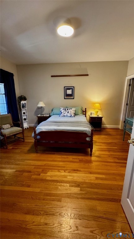 19 Bay Court Kilmarnock, VA 22482 - Photo 37 of 48 a bedroom with a bed and wooden floor