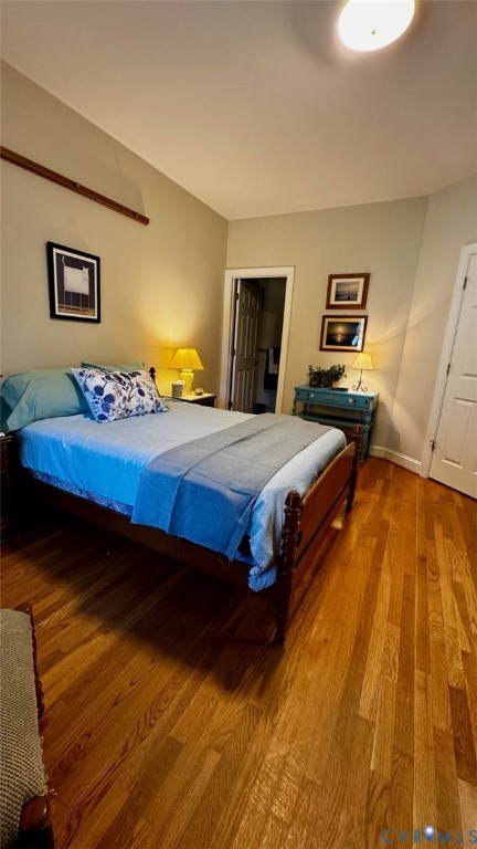 19 Bay Court Kilmarnock, VA 22482 - Photo 39 of 48 a bedroom with a bed and wooden floor