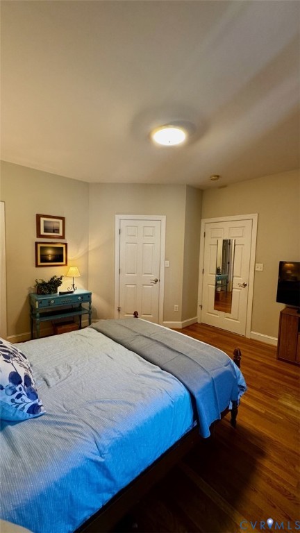 19 Bay Court Kilmarnock, VA 22482 - Photo 40 of 48 a bedroom with a bed and wooden floor