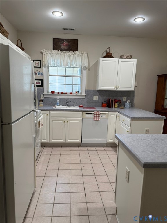 19 Bay Court Kilmarnock, VA 22482 - Photo 6 of 48 a kitchen with stainless steel appliances granite countertop a sink stove refrigerator and cabinets