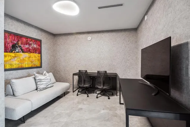 an aerial view of a house with a lake view