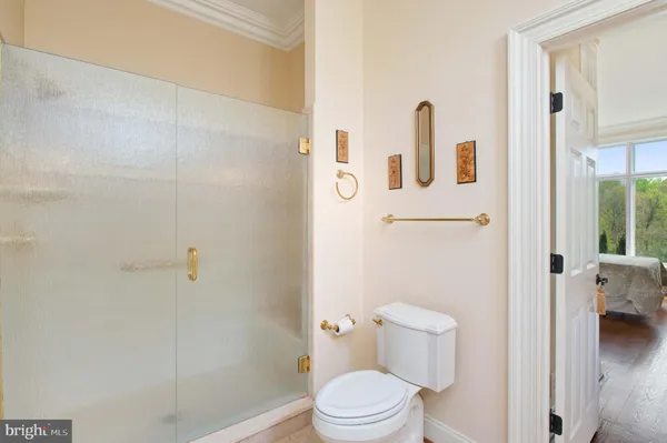 a spacious bathroom with a double vanity sink mirror and shower
