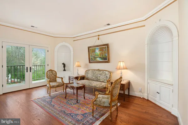 a spacious bedroom with a bed and a large window
