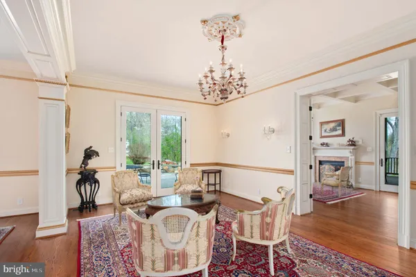 a living room with fireplace furniture and a fireplace