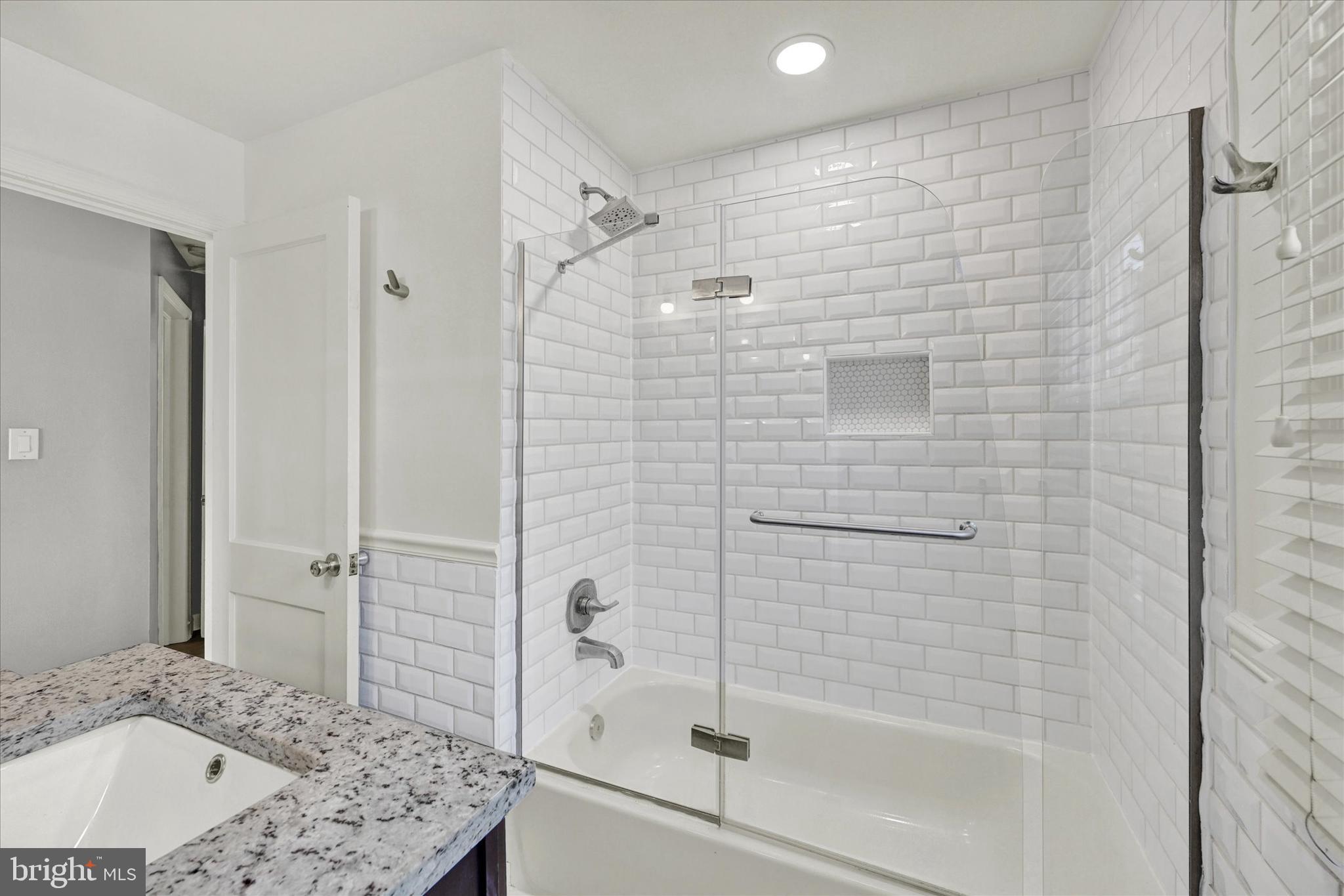 2019 Hillcrest Road Gwynn Oak, MD 21207 - Photo 16 of 29 a bathroom with a bathtub and shower