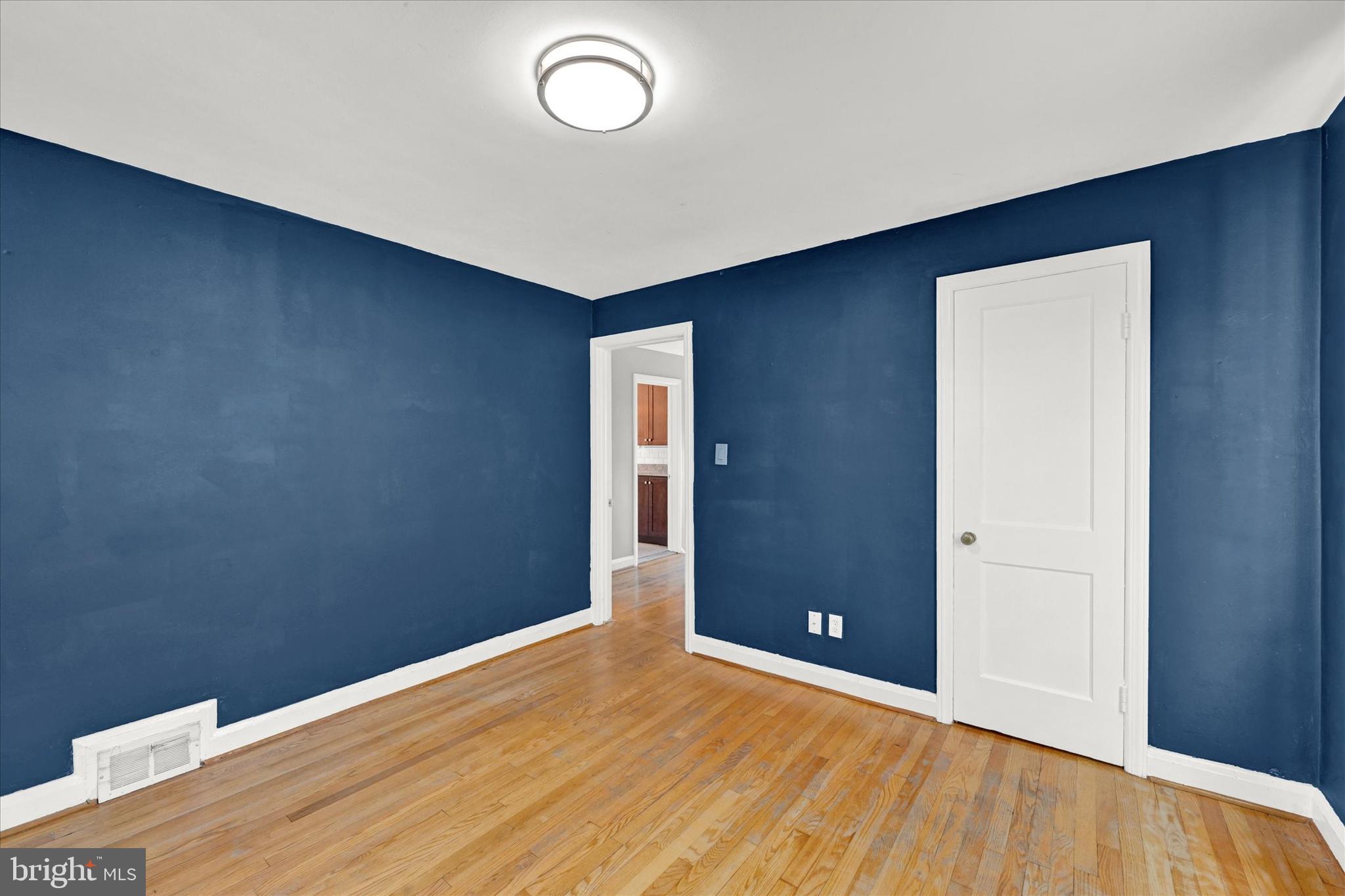 2019 Hillcrest Road Gwynn Oak, MD 21207 - Photo 20 of 29 a view of an empty room with wooden floor