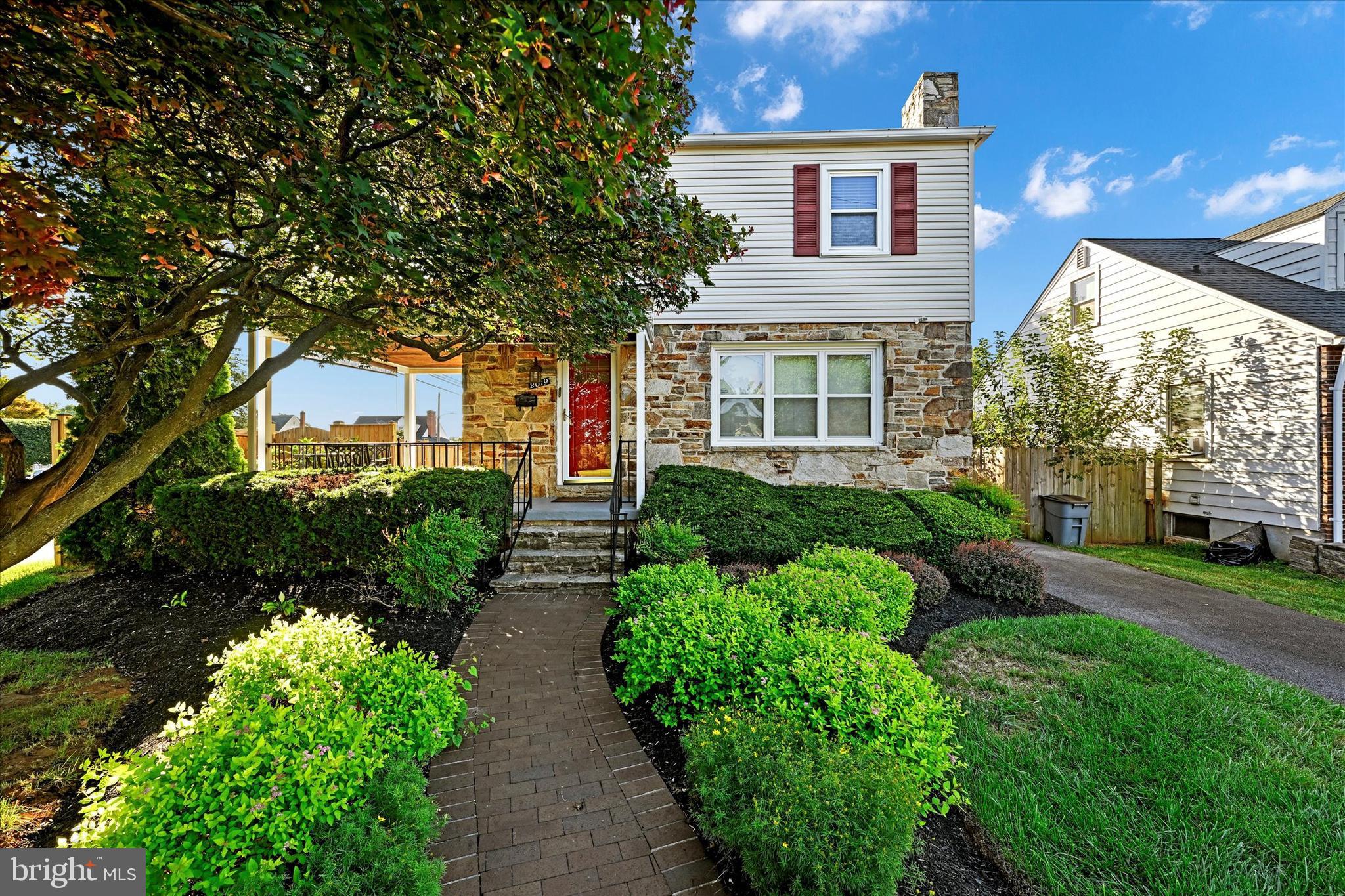 2019 Hillcrest Road Gwynn Oak, MD 21207 - Photo 2 of 29 a front view of a house with a yard and outdoor seating
