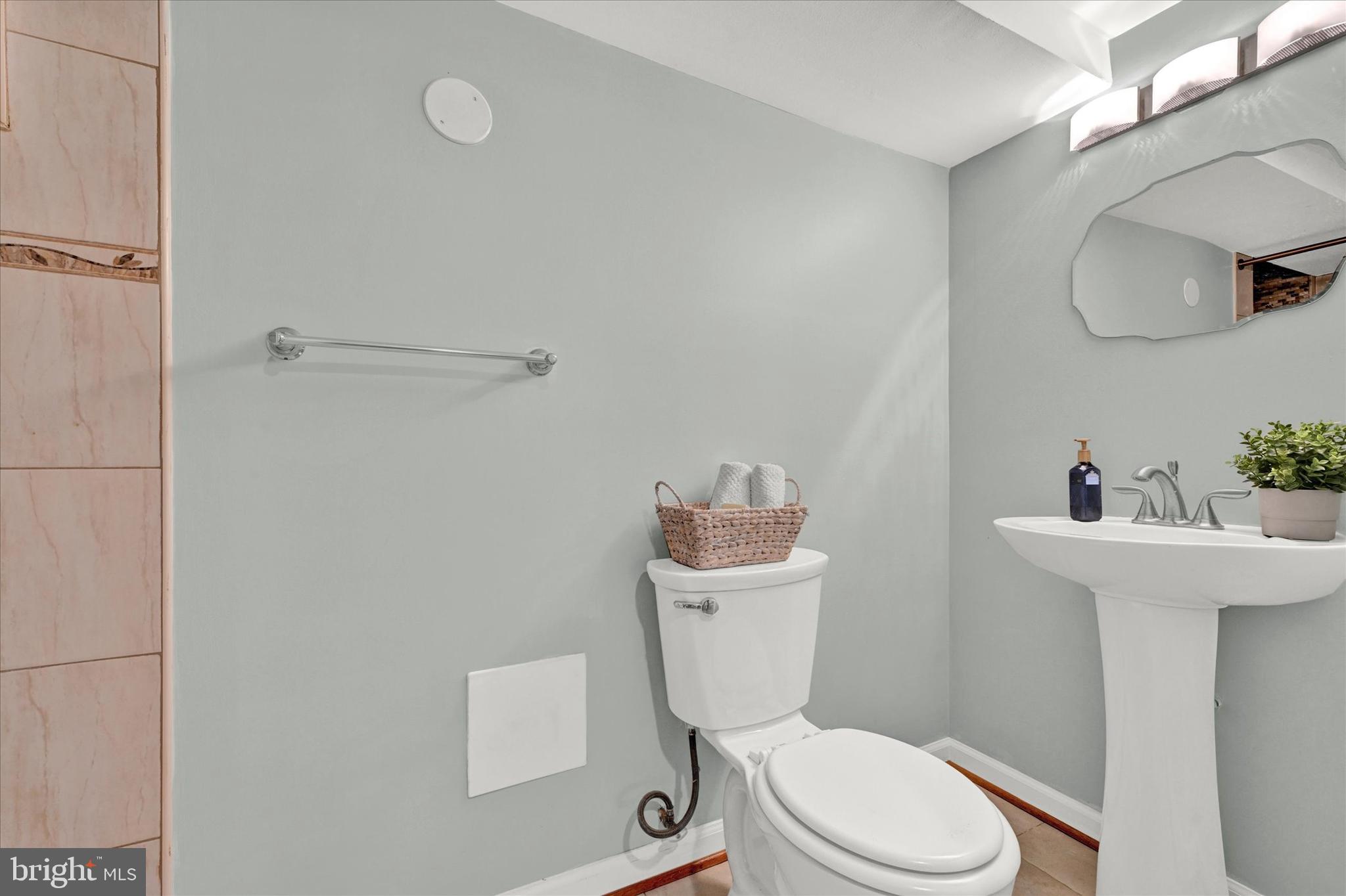 2019 Hillcrest Road Gwynn Oak, MD 21207 - Photo 24 of 29 a white toilet sitting next to a bathroom sink