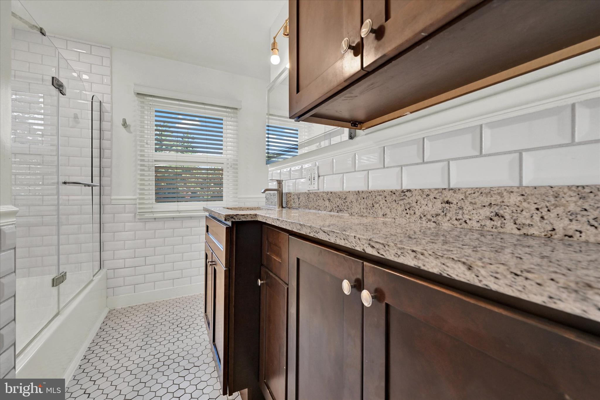 2019 Hillcrest Road Gwynn Oak, MD 21207 - Photo 10 of 29 a kitchen with granite countertop sink and cabinets