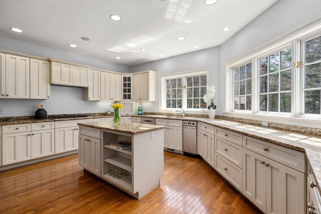 1 Beard Way Wellesley, MA 02482 - Photo 12 of 41 a kitchen with granite countertop white cabinets and wooden floor
